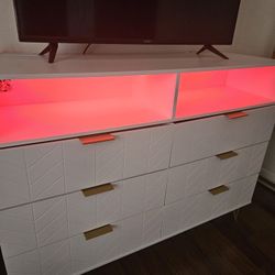 Dresser TV Stand. Synthetic Grass  Vaccum Bot 