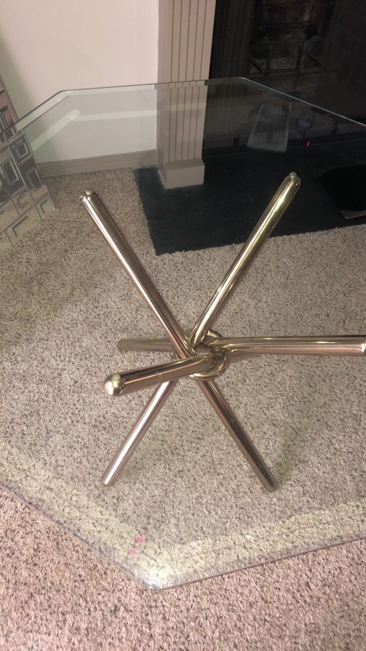 Octagon glass table with gold/brass base (46 in width 28 height)