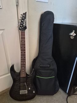 Ibanez Gio Black guitar with gear