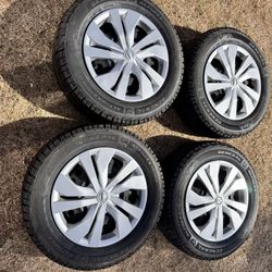 2025 Nissan Versa OEM rims with new winter tires 