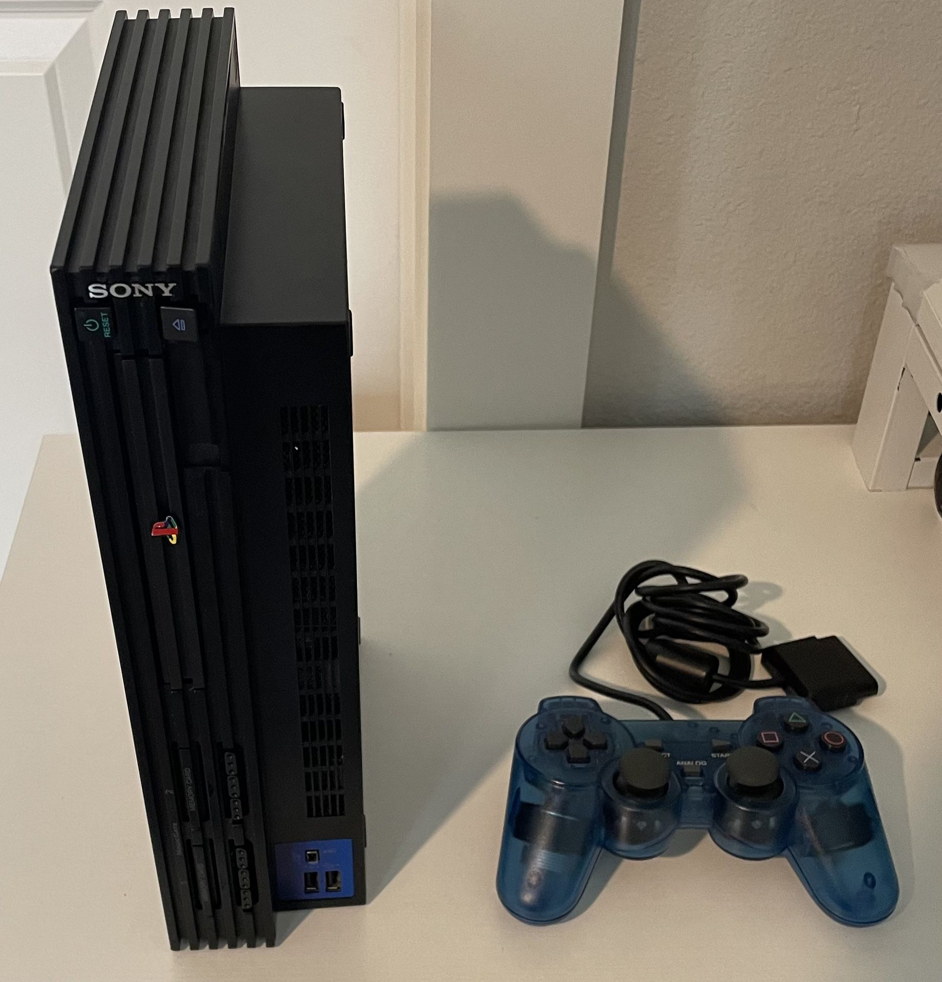 Ps2 with transparent blue controller 