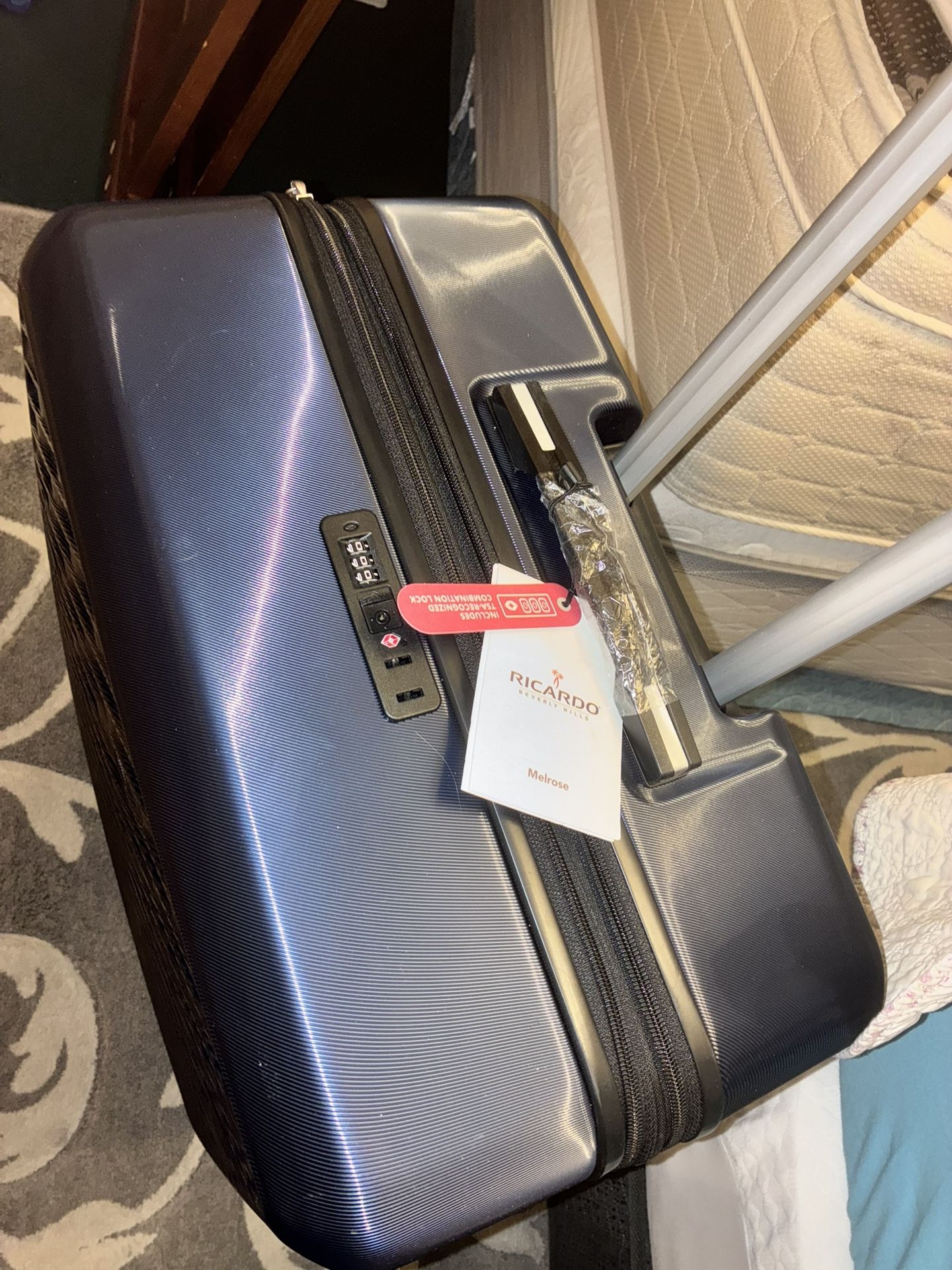 $120 Extra large lockable hard shell suitcase on wheels brand new never used plastic and tags still on it. Downsizing extras- got last year never used