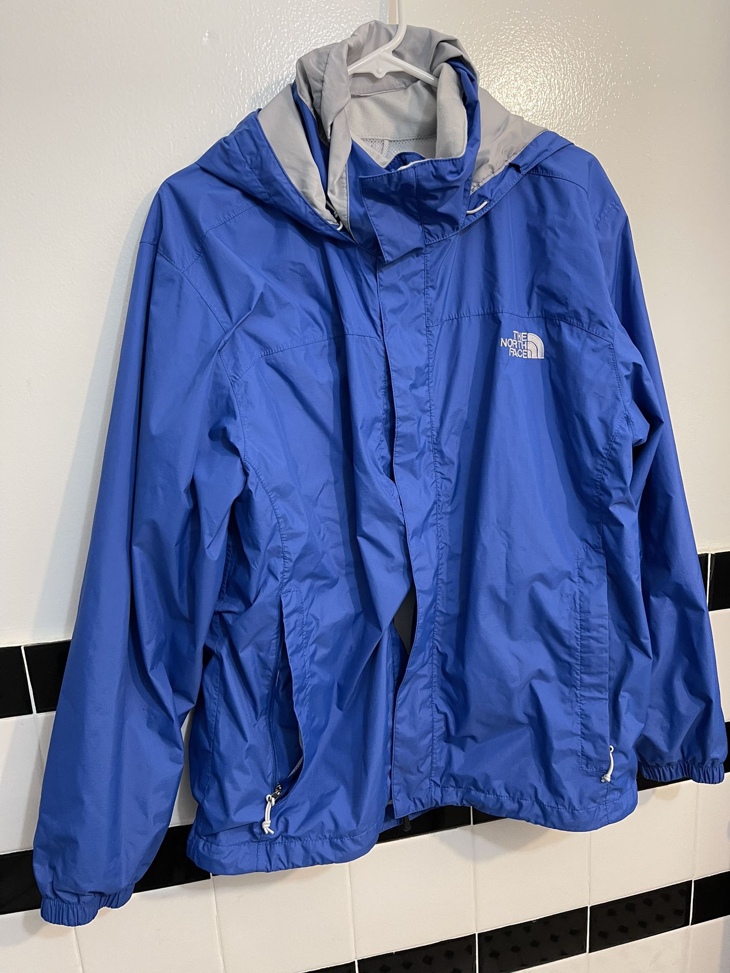 The North Face **blue windbraker ** rain jacket size medium >>with hoodie<<