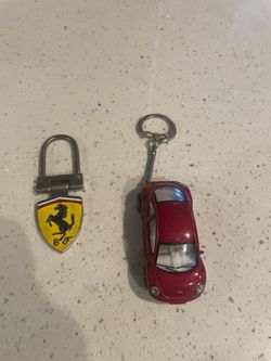 2 key chains Volkswagen and Ferrari