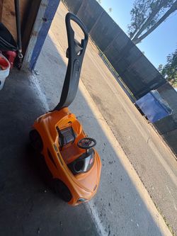 Orange push car w/seat compartment Step2 McLaren Push Sports Car