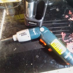 Black & Decker VersaPak cordless screwdriver with its charger and battery