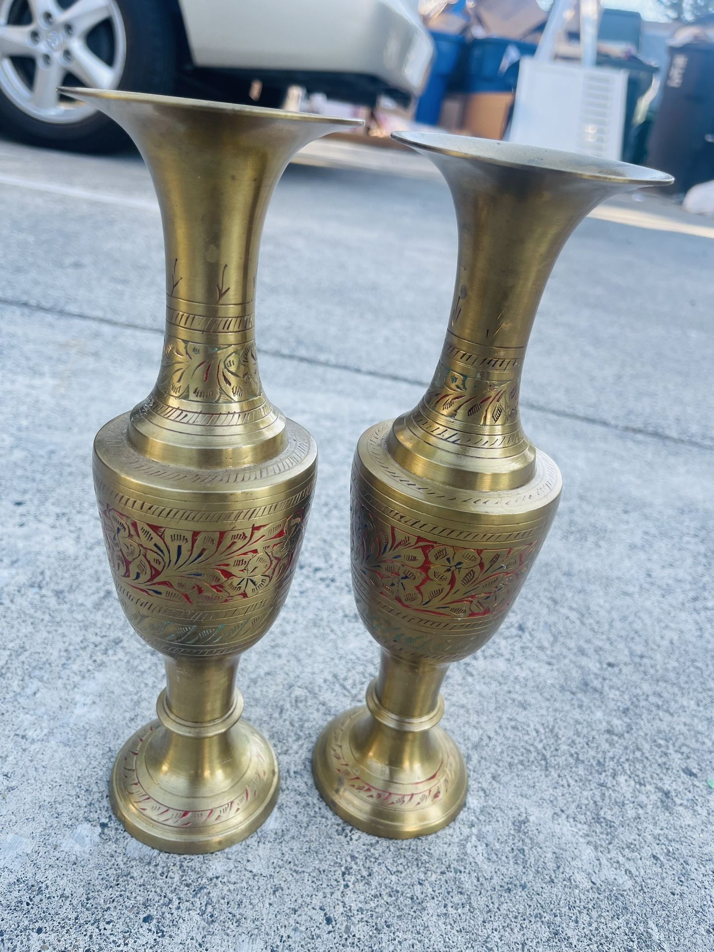 vintage brass vase, likely from India, featuring intricate hand-etched designs and a fluted pedestal.