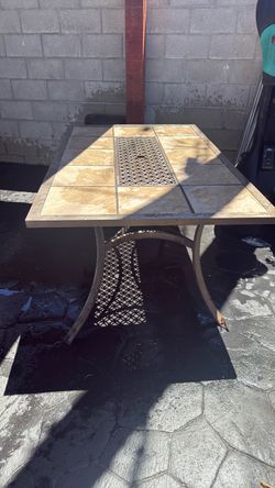 Free  patio table .  1 leg is a little broken still stand perfectly.
