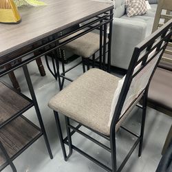 Table With Two Chairs And Shelves Available 