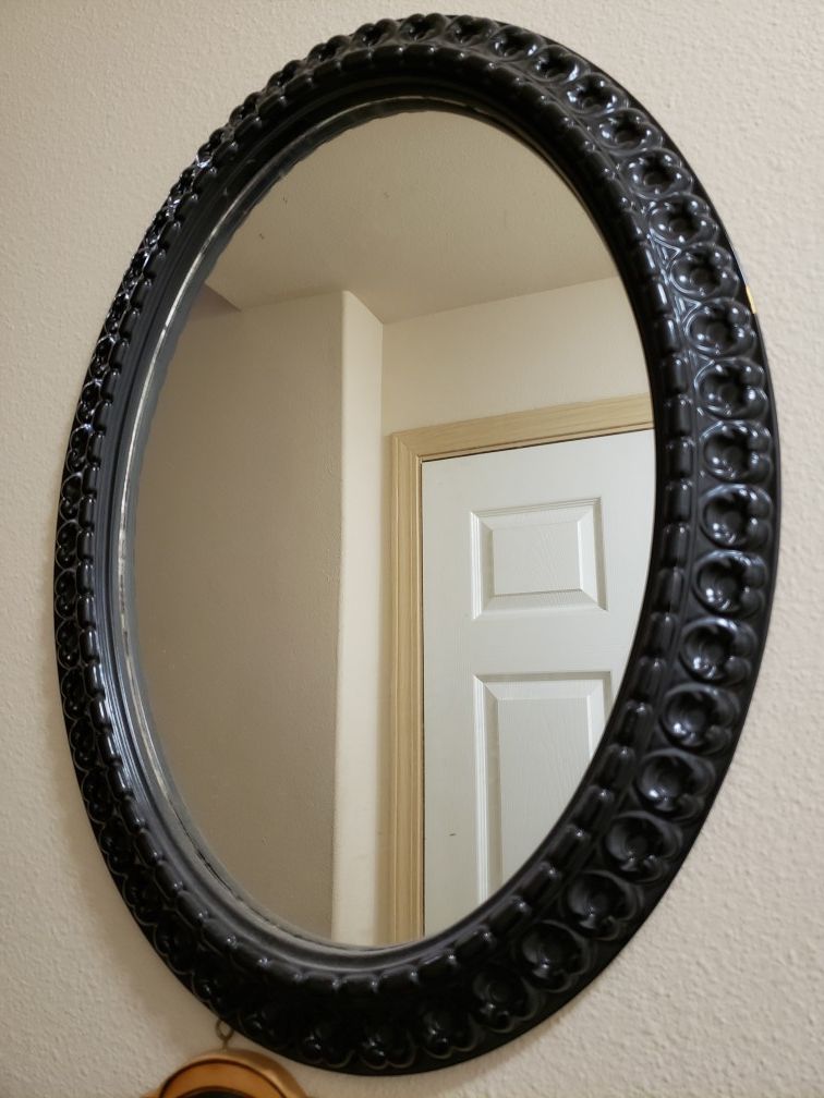 Black oval mirror