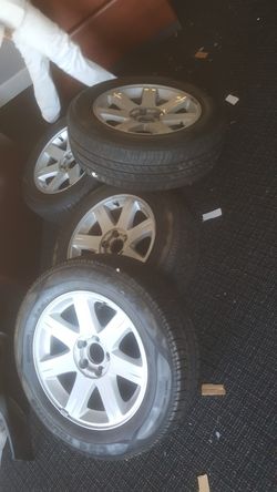 Set Of 4 Chrysler Rims Tires Are Like New 
