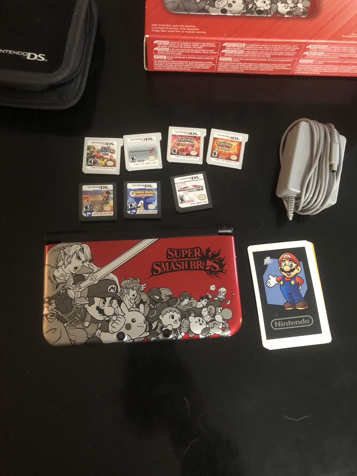 Nintendo 3DS XL Super Smash Bro’s edition with games, case, and box