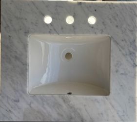Two porcelain white and grey streaks sinks