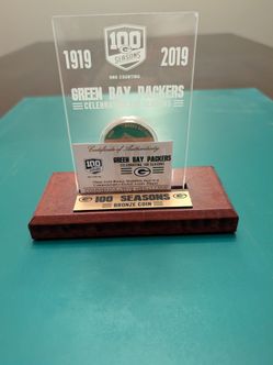 Green Bay Packers 100 Seasons Bronze Coin Acrylic Plaque, a limited-edition collectible produced by The Highland Mint