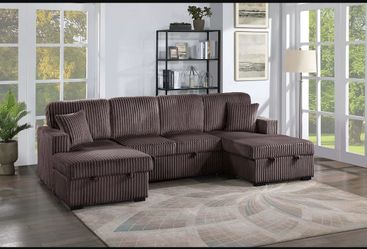 Sectional sofa with pull out bed and storage.