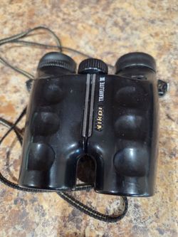 Nikkon Travel Lite 111 binoculars, with carry bag n neck strap 9x24 view, used$20.00