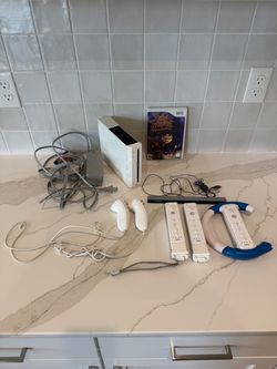 Nintendo Wii console with accessories and game