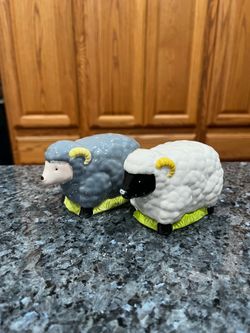 Ceramic Sheep Gray & White Pair of Salt and Pepper Shakers.  Preowned never used.  Made in Japan stickers on the bottom .  Size appropriately 2 1/2 in