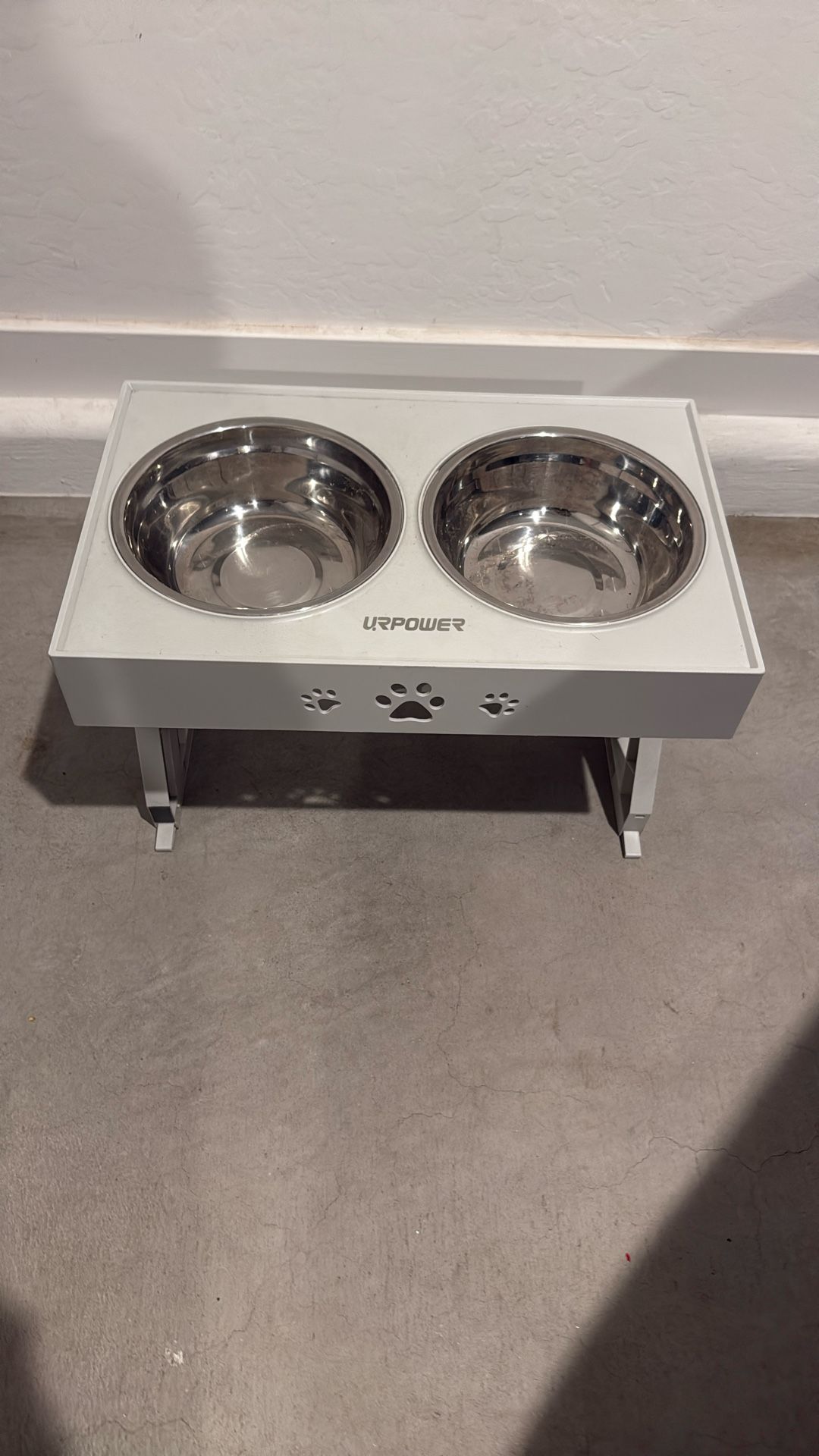 Selling my dog bowls goes up and down white medium size bowls