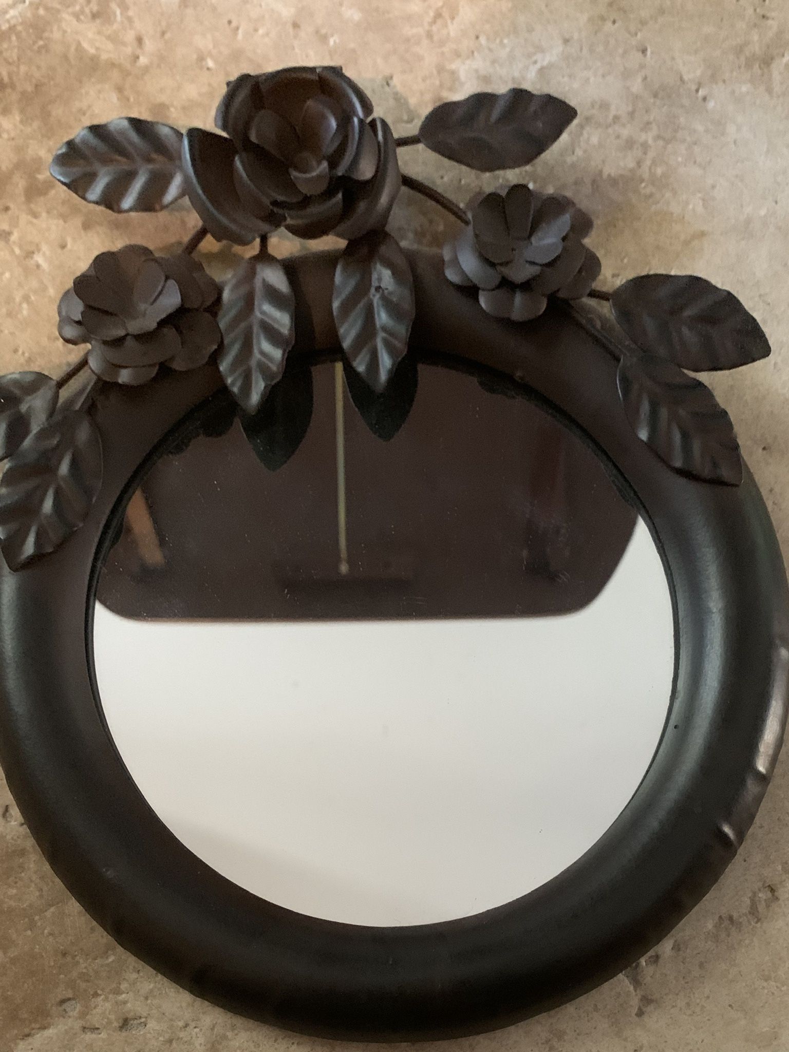 Oil Rubbed Bronze Decorative Floral Mirror. Dimensions are 10.5” x 9” Excellent Used Excellent Used Condition