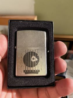 Never used Zippo lighter guitar fret and pick design