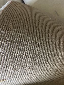Rolled Tan Berber Loop Carpet