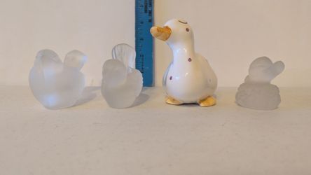 Two glass bird candle holders and two ducks
