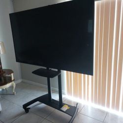 Samsung TV with rolling stand 