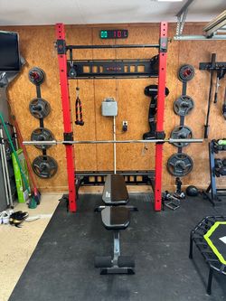 Ethos folding squat rack with spotter arms and Olympic bar