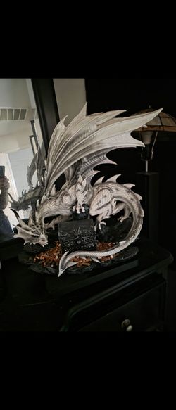 Dragon statue with treasure chest