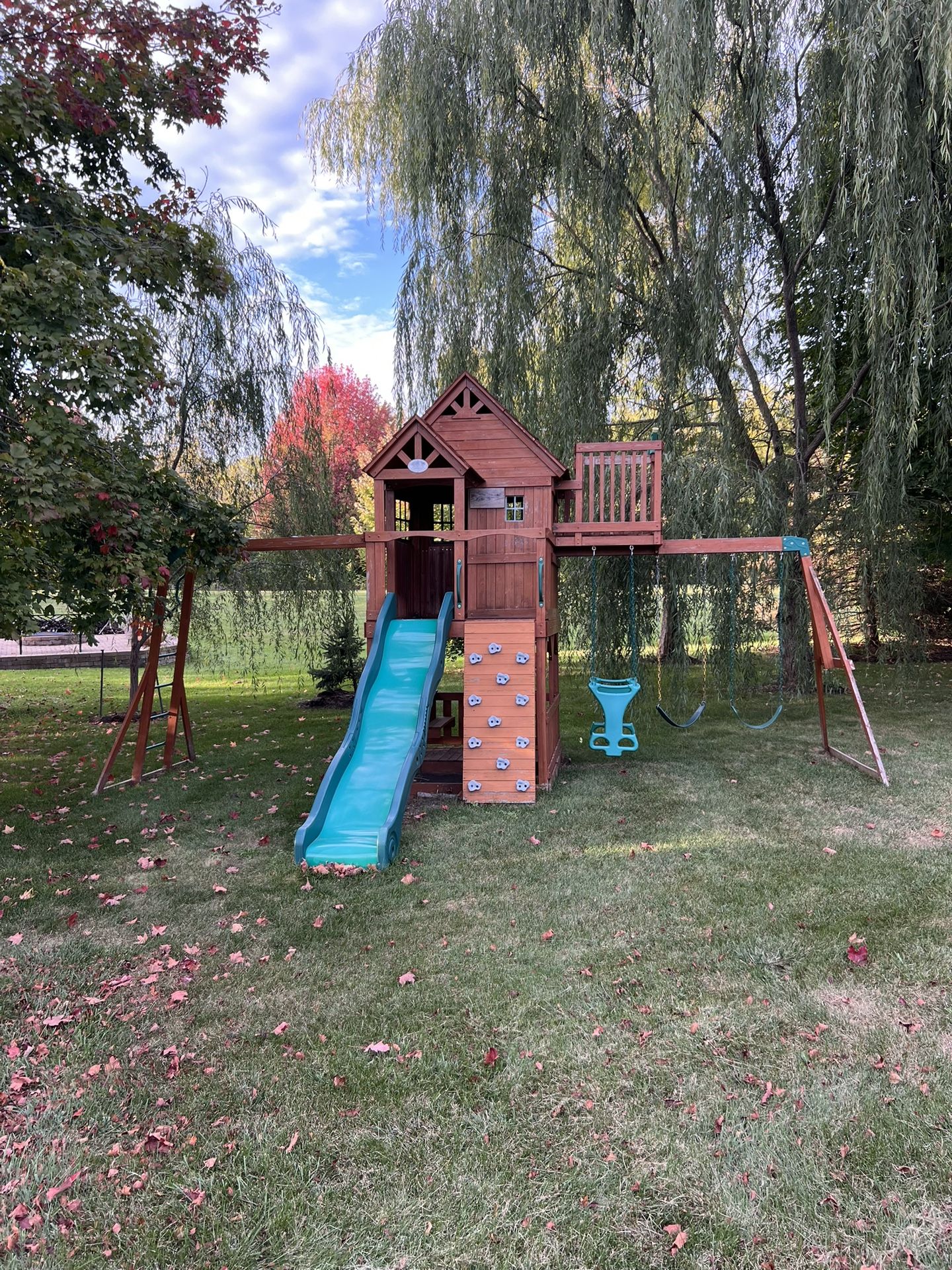 Backyard Discovery Skyfort Cedar Wood Swing Set with Wave Slide, Clubhouse, Crow's Nest, and Monkey Bars 