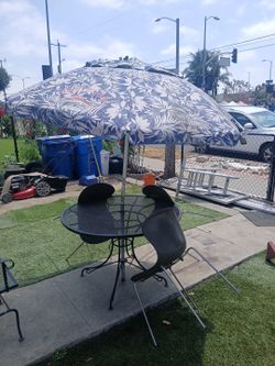 Metal Table With Umbrella And Chairs 