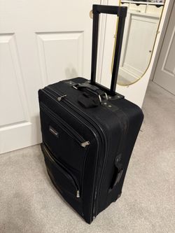 Black rolling Suitcase 26” x 15” x 9”