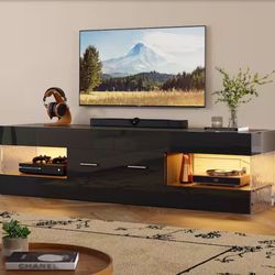 60 in. Glossy Black Ripple Side TV Stand Fits TV Up to 65 in. Entertainment Center with Drawer LED Light