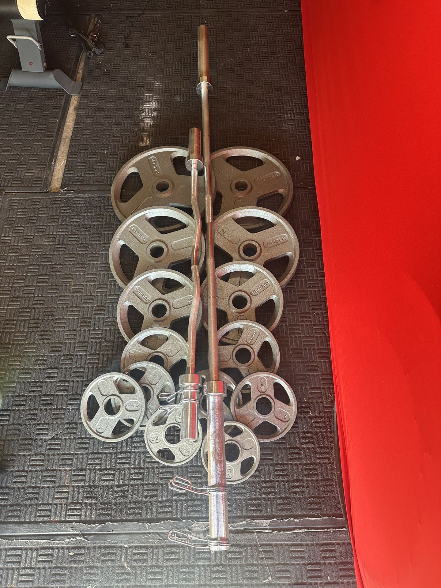 Olympic weights 255lbs total plus 7ft 45lbs bar and curl bar