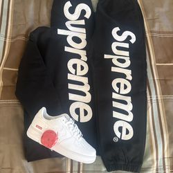 black supreme satin appliqué sweat suit and white supreme air forces