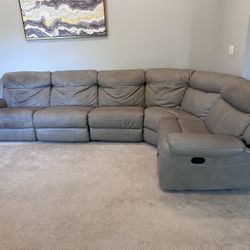 Haverty’s Gray sectional reclining couch- 2 manual and 1 power recline