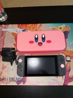 Nintendo Switch with Kirby The forgotten Land game and case