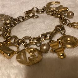 7.5” Vintage Goldtone Charm Bracelet..12 Charms…By (C.G.I. Inc)