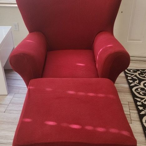 Chair and Ottoman With Red Slip Covers