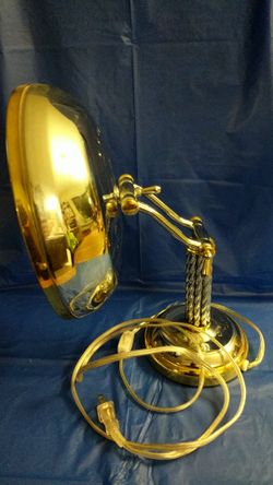 Articulating magnifying mirror with light