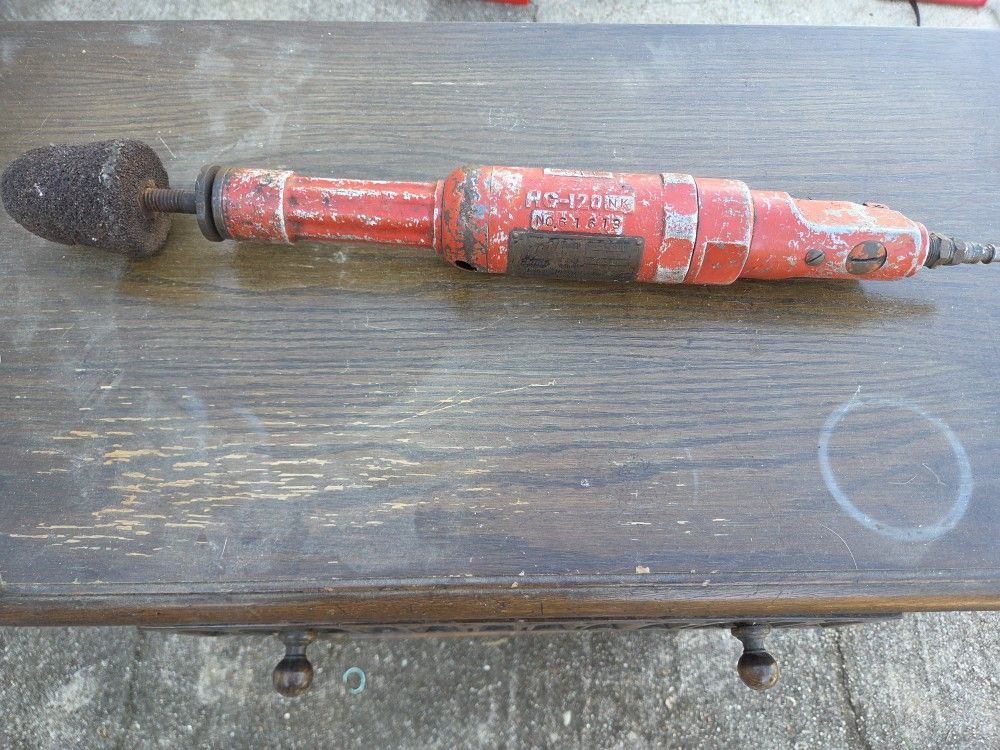 Used red HG-120NK air-powered die grinder with abrasive head
