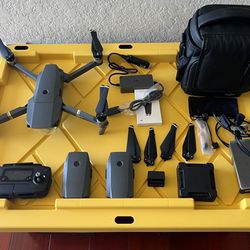 DJI mavic pro with 3 batteries, 4 extra propellers, dual usb charging block, 2 extra remote to phone cables, quad charging station, and portable case.