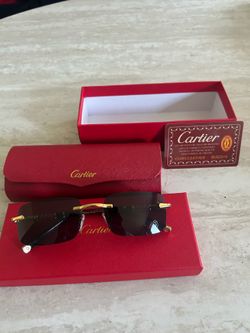 Black and gold Cartier glasses