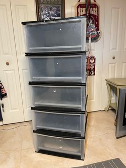 Tall storage drawers,  deep drawers, consist of five individual pieces that jack on top of each other and a top section