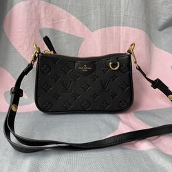 Black Monogram Embossed Pochette Bag 