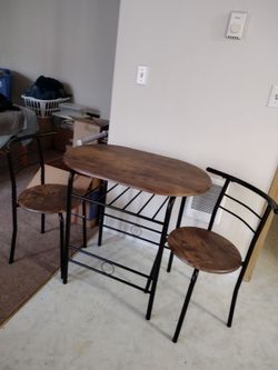 Small set Table and chairs with wine storage $60