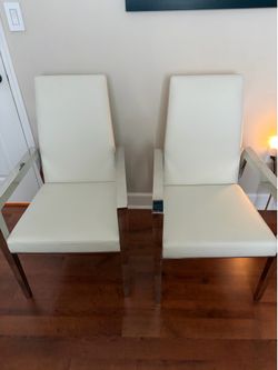 Two leather with stainless steel chairs $200 both they cost $350 each in el dorado furniture