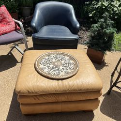 Leather ottoman and a caramel tan color great condition smoke-free home no cut