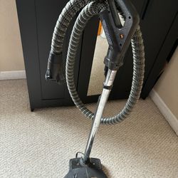 RAINBOW vacuum hose floor sweeper.